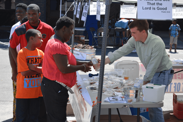 Giving Water out to the people Giving Water out to the people